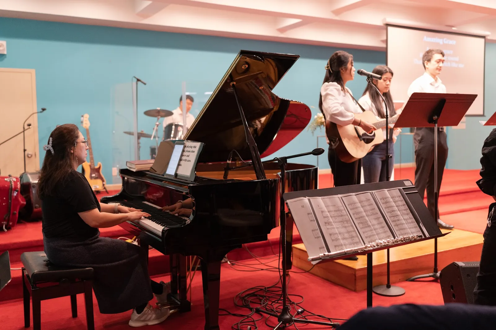 Praise team with piano at worship