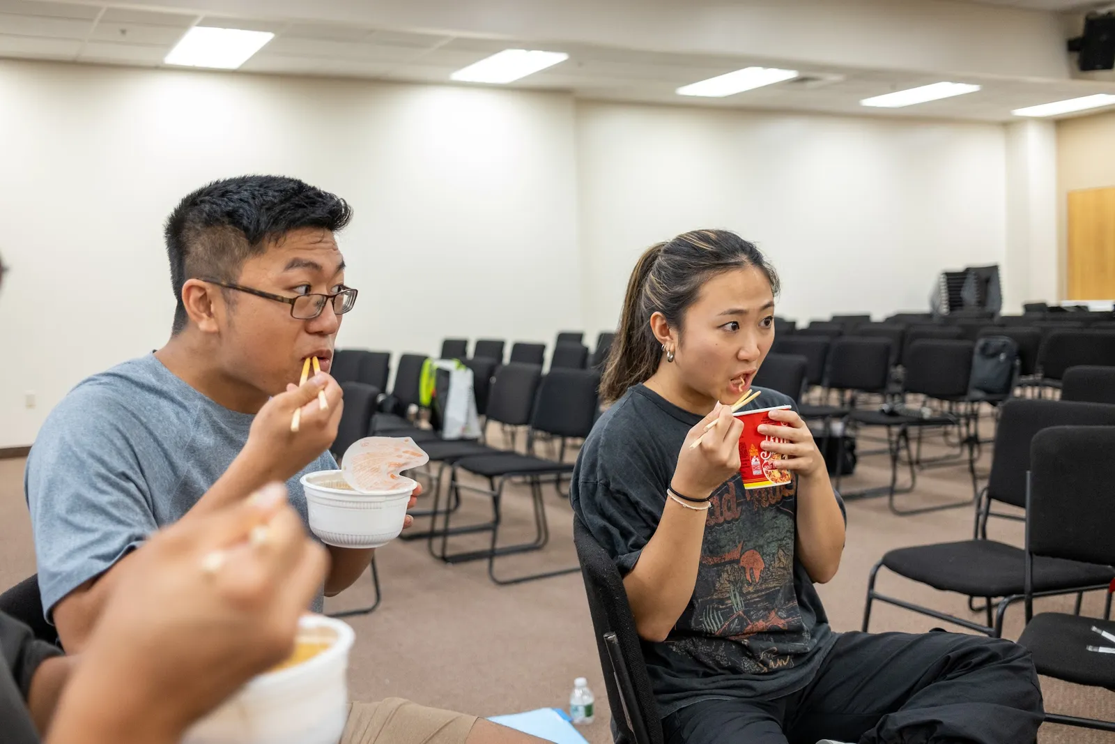Young adults talking over snacks