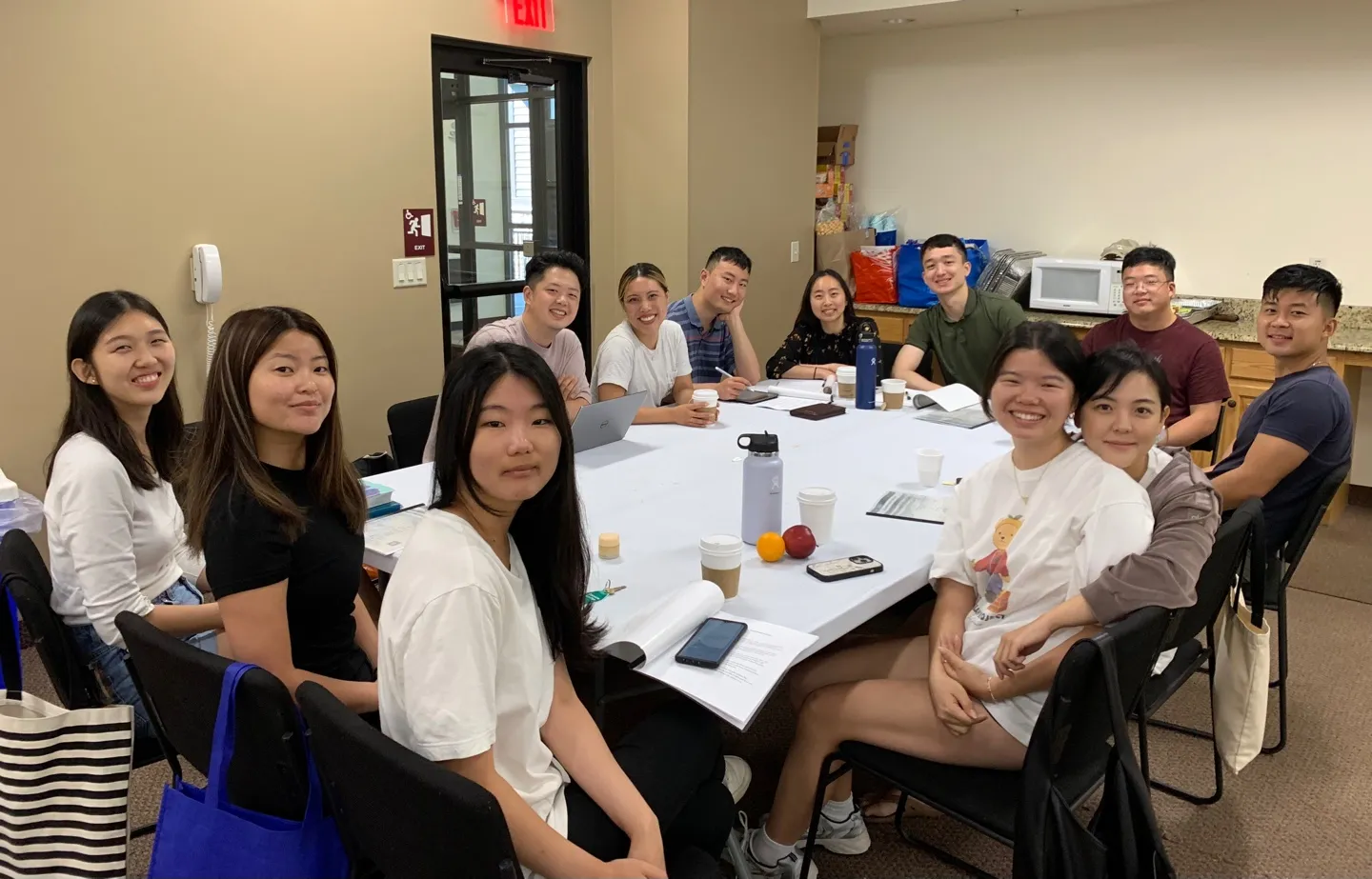 Young adults at a Bible study table